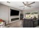 Comfortable living room features a modern fireplace, large TV, and plenty of natural light at 3763 S Laurel Way, Chandler, AZ 85286