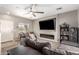 Comfortable living room with a modern fireplace, flatscreen tv, and a ceiling fan at 3763 S Laurel Way, Chandler, AZ 85286