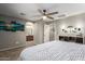 Neutral-toned main bedroom with storage, ceiling fan, and en-suite bathroom at 3763 S Laurel Way, Chandler, AZ 85286