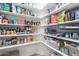 Organized walk-in pantry with shelves stocked with food items and household goods at 3763 S Laurel Way, Chandler, AZ 85286