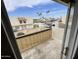 Balcony view of palm trees, townhomes, and a parking area under a bright blue, partly cloudy sky at 3840 N 43Rd Ave # 73, Phoenix, AZ 85031