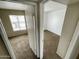 Carpeted bedroom featuring neutral walls and trim, with a view to the outdoors from the window at 3840 N 43Rd Ave # 73, Phoenix, AZ 85031