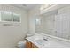 Bright bathroom featuring laminate floors, a sink, and an oversized mirror at 4441 E Via Dona Rd, Cave Creek, AZ 85331