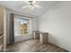 Bedroom featuring gray laminate flooring, a bed frame, and natural light at 4441 E Via Dona Rd, Cave Creek, AZ 85331