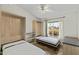 Bedroom featuring gray laminate flooring, murphy beds, and natural light at 4441 E Via Dona Rd, Cave Creek, AZ 85331