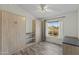 Bedroom featuring gray laminate flooring, murphy beds, and natural light at 4441 E Via Dona Rd, Cave Creek, AZ 85331