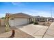 Single-story home with tile roof, two car garage, and low maintenance desert landscaping at 4441 E Via Dona Rd, Cave Creek, AZ 85331