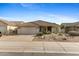 Charming single-story home with a desert landscaped front yard and a two car garage at 4441 E Via Dona Rd, Cave Creek, AZ 85331