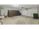 Spacious garage includes a full wall of storage cabinets along the left-hand wall at 4441 E Via Dona Rd, Cave Creek, AZ 85331