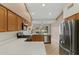 A bright kitchen with countertops and modern stainless steel appliances at 4441 E Via Dona Rd, Cave Creek, AZ 85331