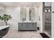 Elegant bathroom featuring a soaking tub, dual vanity, and a glass-enclosed shower at 5345 E Mclellan Rd # 107, Mesa, AZ 85205