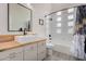 Bathroom featuring a modern vanity, contemporary fixtures, and a tub-shower with glass block window at 5345 E Mclellan Rd # 107, Mesa, AZ 85205