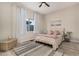 Cozy bedroom with neutral walls, area rug and a ceiling fan at 5345 E Mclellan Rd # 107, Mesa, AZ 85205