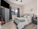 Bedroom featuring wood look floors, a ceiling fan, and neutral walls at 5345 E Mclellan Rd # 107, Mesa, AZ 85205