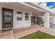 Exterior of home featuring doorway, windows and covered patio with access to outdoor pool at 5345 E Mclellan Rd # 107, Mesa, AZ 85205