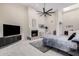 This light-filled main bedroom has tile floors, fireplace, ceiling fan and skylight at 5345 E Mclellan Rd # 107, Mesa, AZ 85205