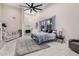 Bright main bedroom featuring tile floors, vaulted ceiling, skylight, and seating area at 5345 E Mclellan Rd # 107, Mesa, AZ 85205