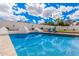 Stunning pool with sparkling blue water and lounge chairs set against a clear sky backdrop at 5345 E Mclellan Rd # 107, Mesa, AZ 85205