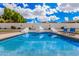 Gorgeous pool with pyramid features and blue lounge chairs offers a refreshing outdoor escape at 5345 E Mclellan Rd # 107, Mesa, AZ 85205