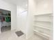 Bathroom featuring tile flooring, a shower with a curtain, and shelving at 5463 E Azara Dr, San Tan Valley, AZ 85140