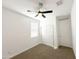 Unfurnished bedroom with plush carpet, a ceiling fan, and a closet at 5463 E Azara Dr, San Tan Valley, AZ 85140