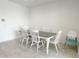 Dining room with a rustic table, six chairs, tiled floor, and lots of natural light at 5463 E Azara Dr, San Tan Valley, AZ 85140