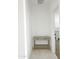 Hallway with a console table and tile flooring; bedroom is visible through the doorway at 5463 E Azara Dr, San Tan Valley, AZ 85140