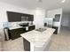 Modern kitchen with stainless steel appliances and a large island with a marbled countertop at 5463 E Azara Dr, San Tan Valley, AZ 85140