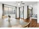 Dining area featuring hardwood floors and an open floorplan with a view of the backyard at 6348 W Hill Ln, Glendale, AZ 85310