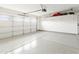 The garage includes a sealed floor, white walls, and a garage door with windows at 6348 W Hill Ln, Glendale, AZ 85310