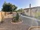 Private backyard featuring low-maintenance landscaping and a concrete walkway at 635 N 67Th Pl, Mesa, AZ 85205