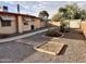 Backyard featuring low-maintenance landscaping and a concrete walkway at 635 N 67Th Pl, Mesa, AZ 85205