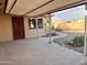 Covered patio with a view of the backyard, providing a shaded outdoor space for relaxation and gatherings at 635 N 67Th Pl, Mesa, AZ 85205