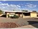 Charming single-story home with a brick facade, low-maintenance landscaping, and a two-car garage at 635 N 67Th Pl, Mesa, AZ 85205