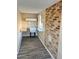 Room featuring brick wall, flooring, shelving, and a sink, creating a functional and visually appealing space at 635 N 67Th Pl, Mesa, AZ 85205