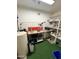 A storage room features a workbench and white shelving at 635 N 67Th Pl, Mesa, AZ 85205