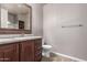 Bathroom features a dark wood vanity with gray countertop and tile flooring at 650 N Hawes Dr # 3622, Mesa, AZ 85207