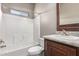 Bathroom features a shower-tub combo and a dark wood vanity at 650 N Hawes Dr # 3622, Mesa, AZ 85207