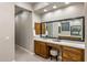 Bathroom vanity and mirror with ample storage are perfect for getting ready in the morning at 6576 E Whispering Mesquite Trl, Scottsdale, AZ 85266