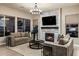 Cozy living room with fireplace provides a relaxing space for the Gathering at 6576 E Whispering Mesquite Trl, Scottsdale, AZ 85266