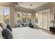 This relaxing main bedroom has beautiful light and large windows at 6576 E Whispering Mesquite Trl, Scottsdale, AZ 85266