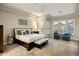 Large main bedroom with tray ceiling, ceiling fan, and lots of natural light at 6576 E Whispering Mesquite Trl, Scottsdale, AZ 85266