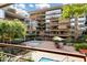 A beautiful courtyard featuring a refreshing pool surrounded by lush landscaping and cozy seating areas at 7167 E Rancho Vista Dr # 2005, Scottsdale, AZ 85251