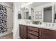 Bathroom with dual sinks, quartz countertop, dark wood cabinets, and shower/tub combo at 7540 E Pampa Ave, Mesa, AZ 85212