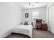 Bedroom with white walls, carpeted floor, and a twin bed at 7540 E Pampa Ave, Mesa, AZ 85212