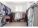 Walk in closet with shelving and rows of hanging clothes at 7540 E Pampa Ave, Mesa, AZ 85212