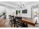 Chic dining room with a rustic wood table, comfortable seating, and stylish decor, great for entertaining at 7540 E Pampa Ave, Mesa, AZ 85212