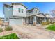 Beautiful two-story home boasts a paved driveway, inviting front porch, and lovely curb appeal at 7540 E Pampa Ave, Mesa, AZ 85212