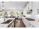 A kitchen featuring white cabinets, stainless steel appliances, and a large kitchen island at 7540 E Pampa Ave, Mesa, AZ 85212