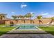 Relaxing backyard pool with lush turf and a tanning ledge, perfect for enjoying sunny days at 7540 E Pampa Ave, Mesa, AZ 85212